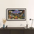 Ingelijste kleurrijke lithografie van Brian Saaby met een feestelijk tafereel in een bosrijke omgeving boven een donker dressoir in een modern interieur van sackit