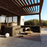 Soft Sofa Outdoor 3 Seater in Kirra Noir van sackit buiten bij natuurlijk licht
