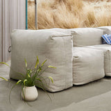 Soft Sofa Outdoor 3 Seater in Kirra Sand van sackit in een buitenomgeving