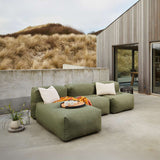 Soft Sofa Outdoor 3 Seater met Lounger in Kirra Olive van sackit op een terras