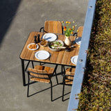 Kirra Dining Table 150x90 in Noir van sackit in een buitenomgeving