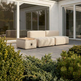 Soft Sofa Outdoor Pouf in Boucle Beige van sackit op een terras