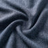 Detail van de donkerblauwe geweven bekleding van de sackit Cobana pouf met een stevige textuur voor binnen en buiten