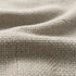 Close up van de grijsbeige geweven bekleding van de Cobana poef met een robuuste textuur voor binnen en buiten van sackit