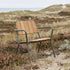Kirra Patio Lounge Chair in olijfgroen van sackit buiten bij natuurlijk licht