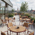 Kirra Café Table in Chestnut van sackit in een buitenomgeving