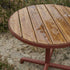 Kirra Café Table in Chestnut van sackit op een terras