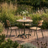 Kirra Café Table in olijfgroen van sackit in een buitenomgeving