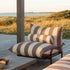 Mollis Lounge Chair in Renesse Chestnut van sackit op een terras