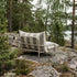 Mollis Lounge Chair in Renesse Taupe van sackit buiten bij natuurlijk licht