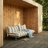 Mollis Lounge Sofa 2 Seater in Renesse Taupe van sackit op een terras