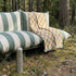 Mollis Lounge Sofa 2 Seater in Renesse Olive van sackit op een terras