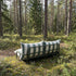 Mollis Lounge Sofa 2 Seater in Renesse Olive van sackit in een ontspannen loungehoek buiten