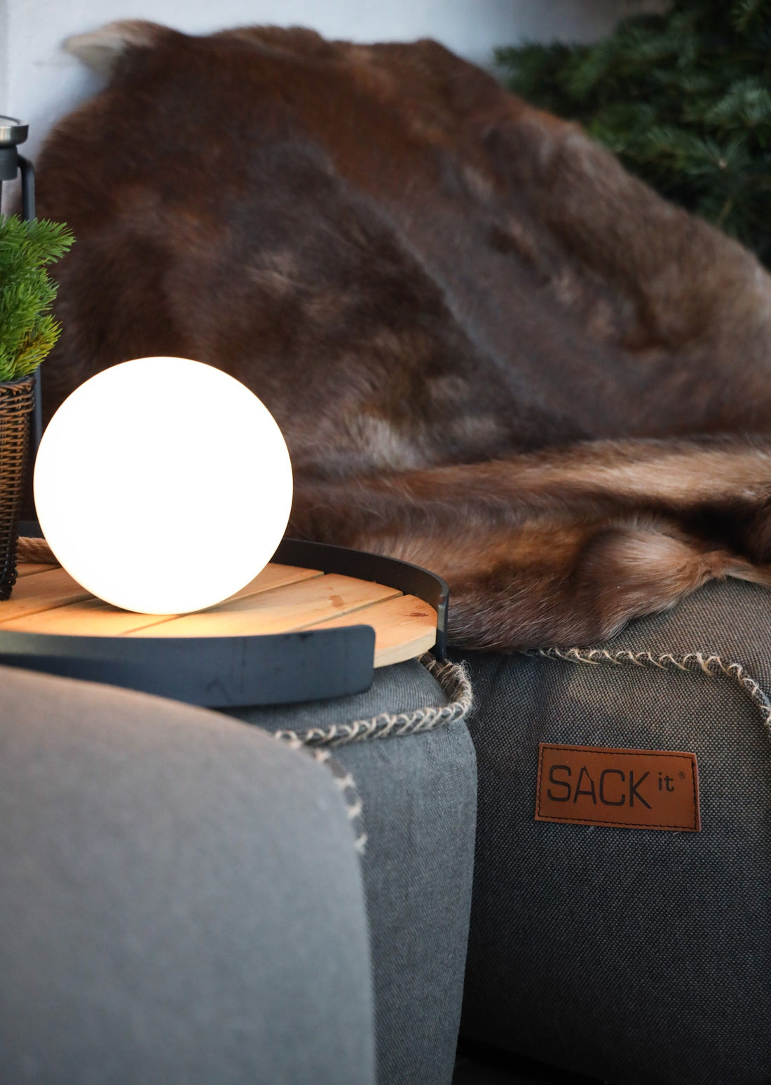 Close-up of durable SACKit beanbags, outdoor lamps and serving trays at Café Peace