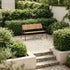 Kirra Patio Bench in Chestnut van sackit in een buitenomgeving