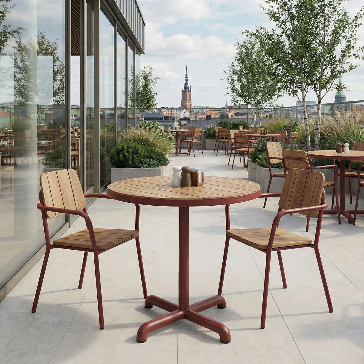 Kirra Café Table in Chestnut van sackit buiten bij natuurlijk licht