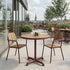 Kirra Café Table in Chestnut van sackit buiten bij natuurlijk licht