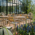 Kirra Cafe Table & 2 Kirra Patio Chair in Taupe van sackit op een terras