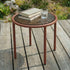Mollis Side Table Ø50 in Chestnut van sackit op een terras